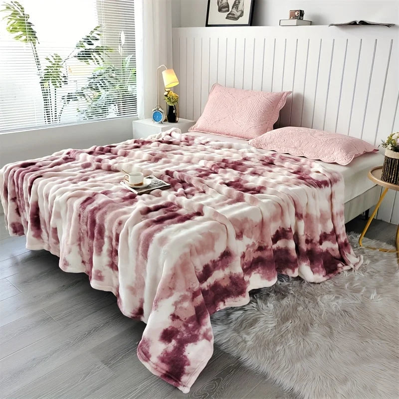 Rose Swirl faux rabbit fur throw on a bed