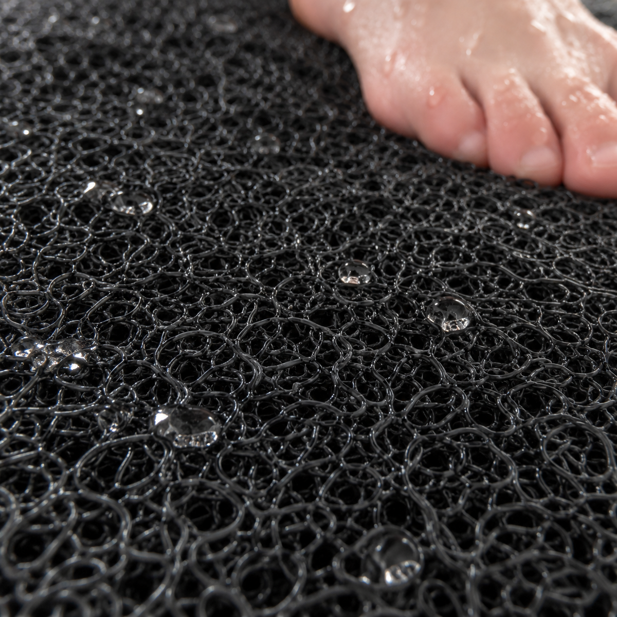 Close-up of the soft loofah texture on the shower mat