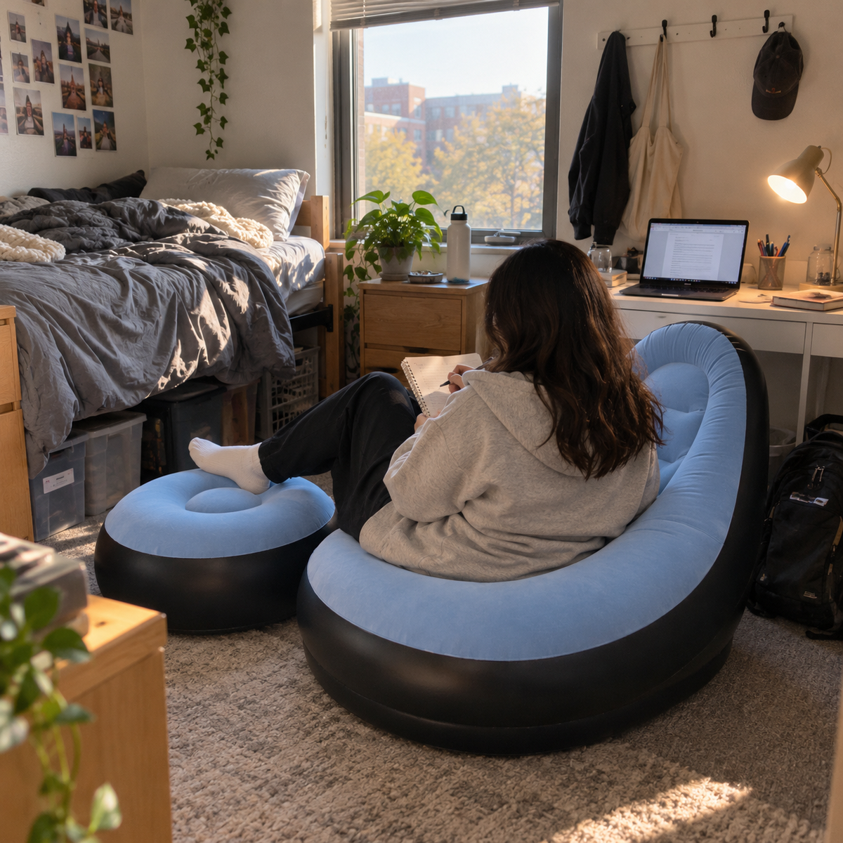 Sky blue inflatable lounge chair and ottoman in a dorm room