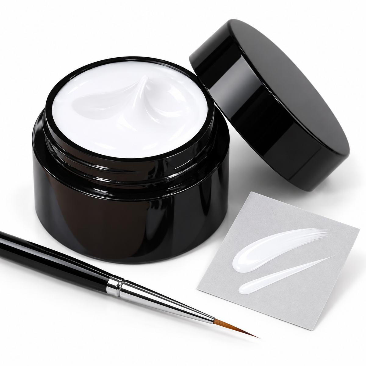 Jar of White painting gel with a fine brush and white strokes