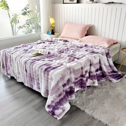 Lavender Swirl faux rabbit fur throw on a bed
