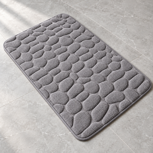 Gray 3D cobblestone non-slip bath mat on a bathroom floor