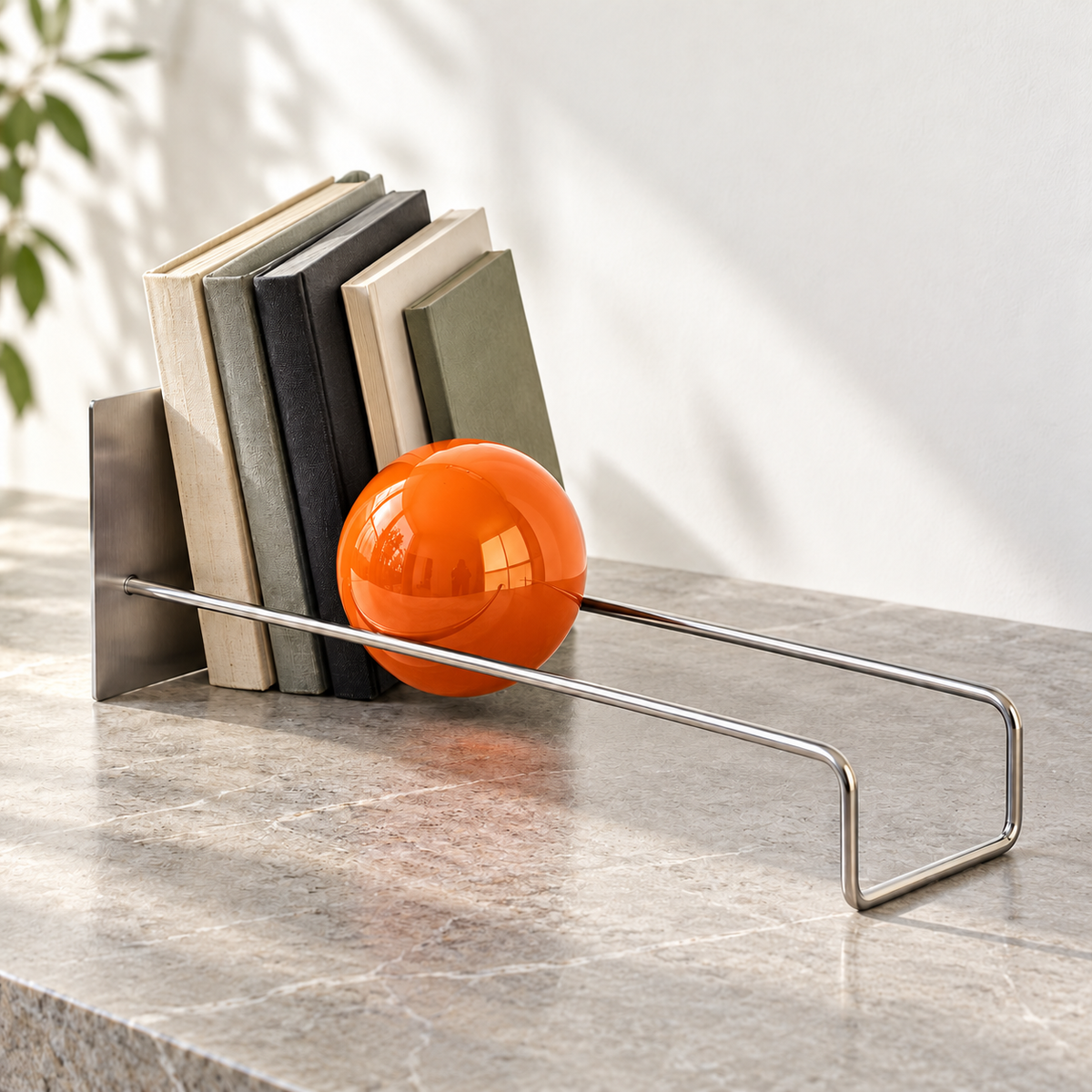 Sphere book holder with an orange sphere