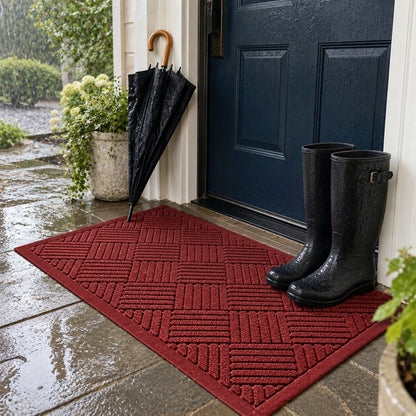 Red door mat on a covered porch on a rainy day