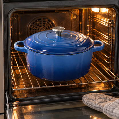 Blue Dutch oven with lid in a home oven
