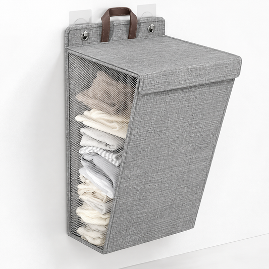 Gray wall-hanging laundry hamper with a lid, mesh side panel and brown handle on adhesive hooks