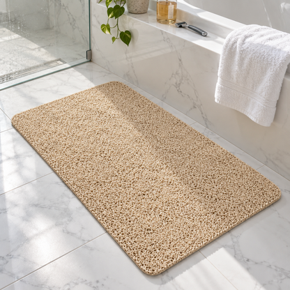 Beige shower mat in a bright bathroom