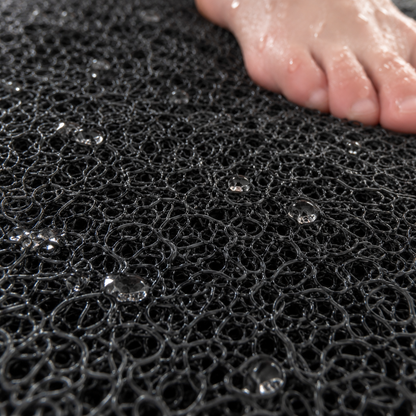 Close-up of the soft loofah texture on the shower mat