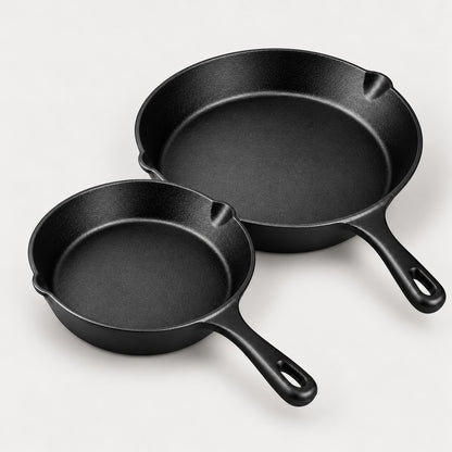 Two pre-seasoned cast iron skillets, 20 and 26 cm