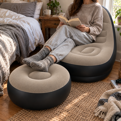 Taupe inflatable lounge chair and ottoman in a bedroom corner with a person reading