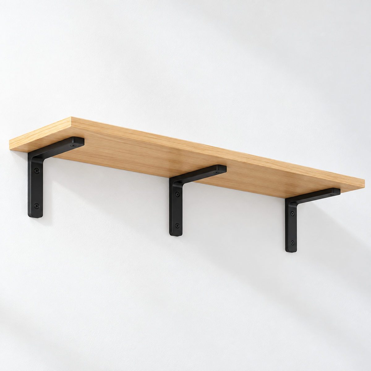Natural Wood wall shelf with three black L-brackets on a white wall